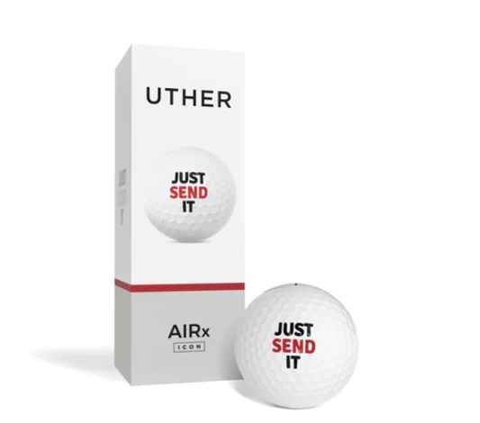 En vit golfboll med texten 'JUST SEND IT' framför en vertikal vit förpackning märkt 'UTHER' och 'AIRx [ICON]' med en röd linje, som också visar samma slogan på sidan av lådan.